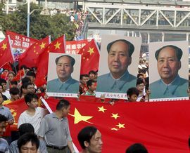 中国社会の不安、焦燥感を映し出す毛沢東の肖像写真（c）AFP=時事